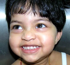 <p>to smile widely</p><p>Example: gave a monstrous grin.</p>