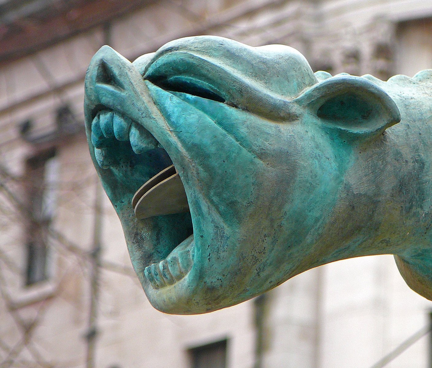 <p>A carved mythical creature for decoration on a building looks similar to gargoyles (as water spouts)</p>