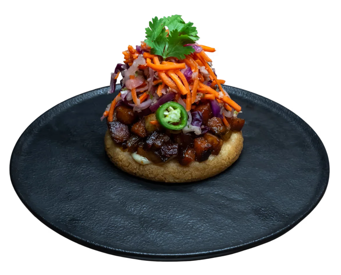 <p>BANH MI PORK BELLY AREPA</p>