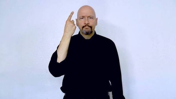 <p>Finger up in air (like holding up number 1, and bending up and down.) <em>shake head too</em></p>