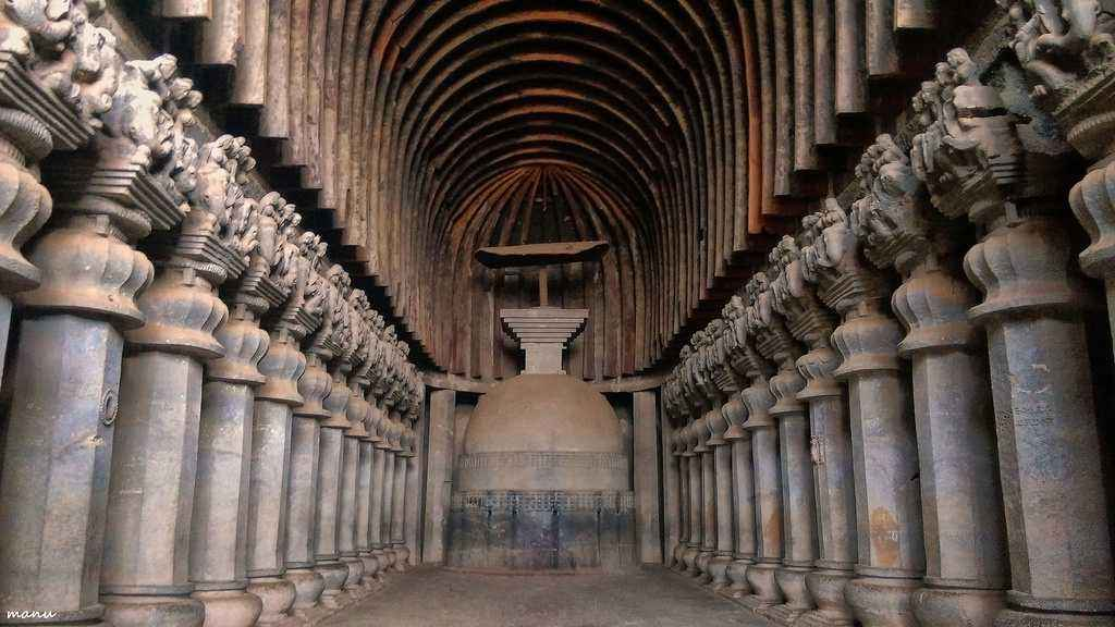 <p>Massive rock-cut prayer hall with a high vaulted ceiling, wooden ribs, 37 carved pillars, and a "sun window" that illuminates the central stupa</p>