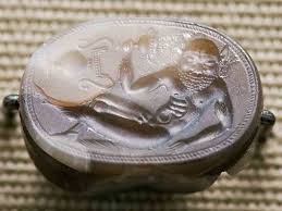 <p><strong><mark data-color="rgba(0, 0, 0, 0)" style="background-color: rgba(0, 0, 0, 0); color: inherit;">a design or figure carved into a hard material (like stone or metal) so that it is sunken below the surface</mark></strong><span>, which is the opposite of a relief carving (cameo). It also refers to a printing technique (e.g., etching, engraving) where ink is held in these recessed lines to transfer images to paper.</span></p>