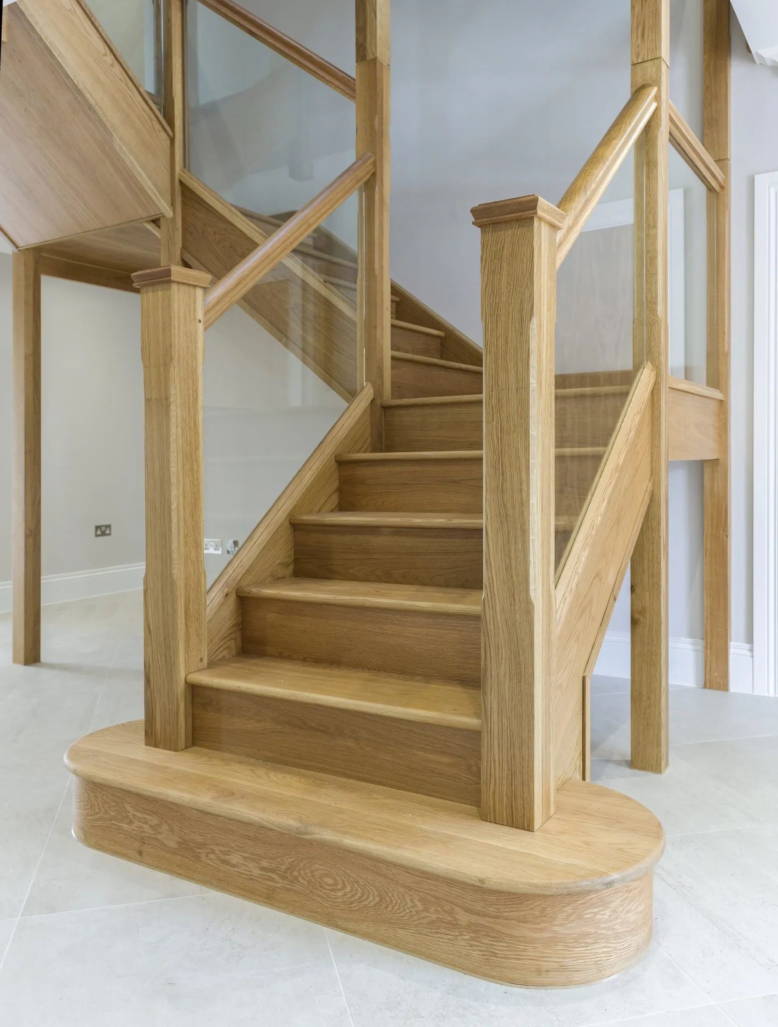 <p>beaded into handrail and baserail - no visible fixings</p>