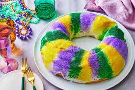 <p>What is hidden inside a traditional king cake?</p>