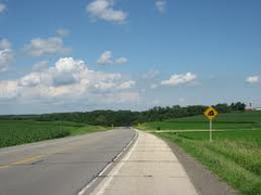 <p>A road shoulder is a strip of land immediately adjacent to the traffic lane of a road not bordered by kerb & channel. The shoulder may be sealed in the case of highways and major roads, but it is typically unsealed and of a lesser depth and perhaps constructed of inferior material than the adjacent traffic lane.</p>