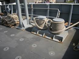 <p>A strong post on a ship used for securing ropes or cables</p>