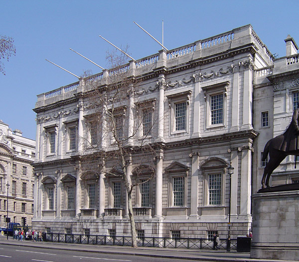 <ul><li><p>Rebuilt by the namesake on the Italian model of Andrea Palladio and inspired by Virtruvius’s Roman treatise which the namesake brought back from Italy</p></li><li><p>Its scale was grandiose and its ceiling panels were commissioned from Peter Paul Rubens by King Charles of England, sent over from Antwerp which depicted the reign of King James in Olympian style</p></li></ul><p></p>