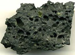 <p>lava texture formed by gas bubbles being trapped within the rock</p>