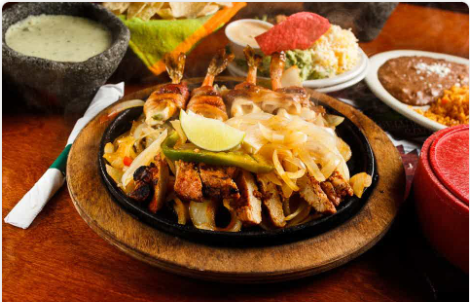 <p>Beef or chicken fajitas and (4) brochette shrimp stuffed with Jack cheese and jalapeno and wrapped in bacon. Served with guacamole, pico de gallo, grated cheese, and our famout butter chipotle sauce.</p>