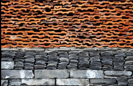 <p>a traditional Chinese vernacular tiling technique that has evolved into a</p><p>hybrid construction process involving brick, stone and roof tiles. Traditionally used in</p><p>villages as a way to utilize materials that were readily available, such as left over roofing</p><p>tiles and broken bricks, it is now becoming part of the new architectural language of</p><p>China as a response to heritage masonry and sustainability.</p>