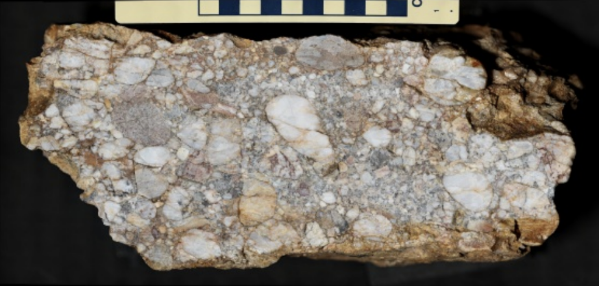 <p>Poorly sorted, rounded clasts >2mm in diameter. Finer-grain sediments constitute the matrix.</p>