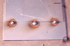 <p>A small, temporary spot weld used to hold metal pieces in the correct position and alignment before the final, full weld is made.</p>