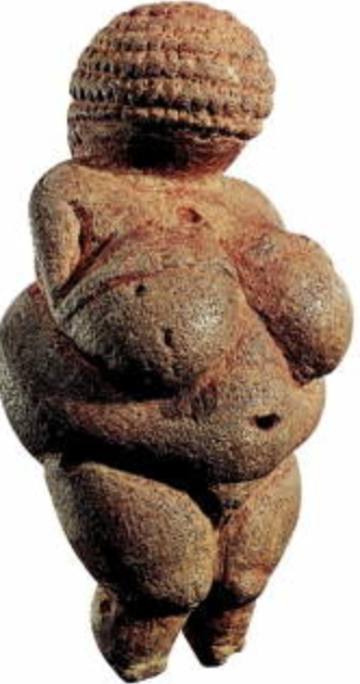 <p>"Venus", limestone tinted with red ochre, 24,000-22,000 BCE, 11.1 cm high, Natural History Museum, Vienna</p>