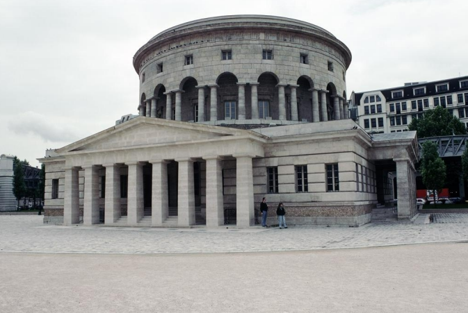 <p>Simplistic where all ornamentation is gone and reduced to simplist architecture. It still has the classical motifes of columar structure, but nothing fun to look at</p>