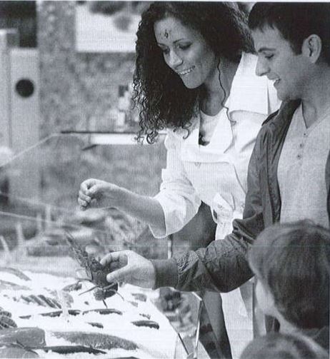 <p><span>holding some seafood</span></p>