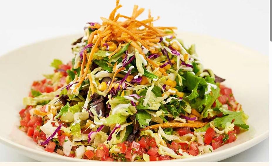 <p>skinny* Crispy Corn Tortilla Topped with Grilled Chicken Breast and Black Beans with Mixed Greens, Fresh Corn, Green Onion and Cilantro. All Tossed in Our SkinnyLicious<span data-name="registered" data-type="emoji">®</span> Vinaigrette and Garnished with a little Avocado Cream Sauce, Salsa and Sour Cream</p>