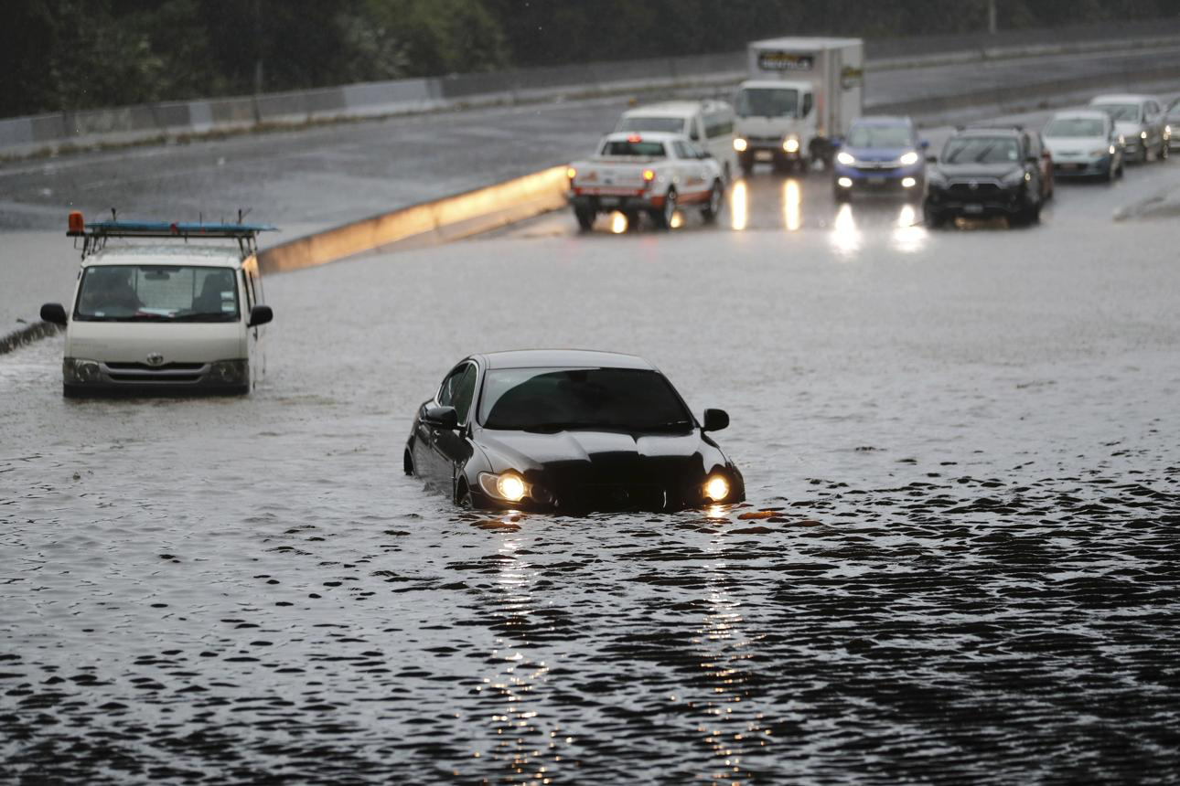 <p>(n) A large amount of rain or water that arrives suddenly and causes flooding.</p>