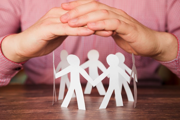 <p>During a meeting, another employee is unfairly criticised even though the mistake wasn't theirs.</p><p>Which phrasal verb can you use to say you want to defend them?</p>