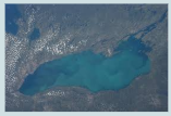<p>Why does heavy snow fall over Lake Ontario after an air mass passes over it during the winter?</p>