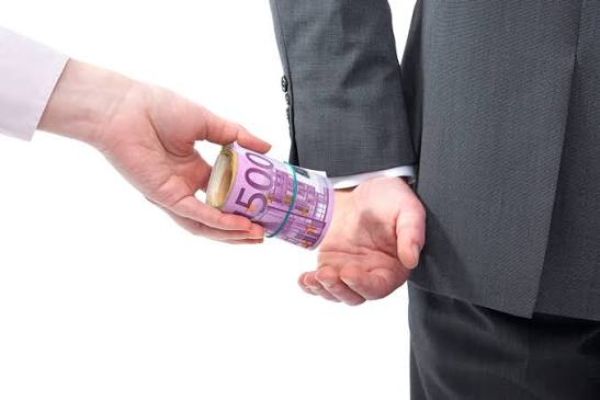 <p><strong>to secretly give someone money in order to persuade them to do something for you</strong></p><p><em>If you want to secure that building permit quickly, you might have to _ the inspector's _.</em></p>