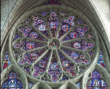 <p>A circular window with foils of patterned tracery arranged like the spokes of a</p><p>wheel.</p>