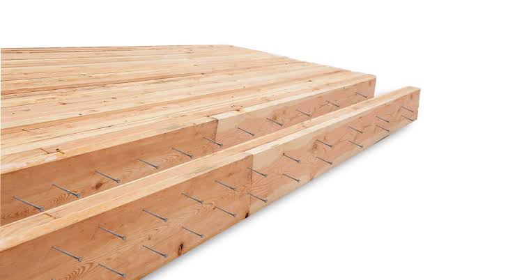 <p><strong>NLT (Nail Laminated Timber)</strong></p><ul><li><p><em>Recunoaștere:</em> Lamele de lemn puse pe muchie (cant) și prinse între ele cu <strong>cuie metalice</strong>, nu cu lipici. Se văd capetele cuielor pe suprafață.</p></li><li><p><em>Utilizare:</em> Planșee rustice / industriale aparente.</p></li></ul><p></p>
