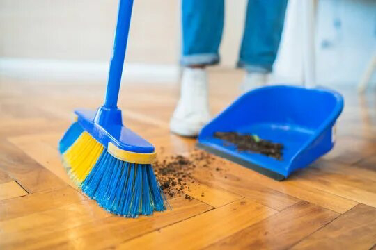 <p>To clean a floor or ground surface by using a broom or brush to push dust, dirt, or debris into a pile for removal. </p><p>[tuː swiːp ðə flɔː]</p>