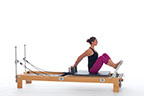 <p><strong>Setup</strong></p><ul><li><p>Starting in Stomach Massage position (page 58), arms bent, hands on shoulder rests, fingers facing away from body, back straight</p></li><li><p>Resistance: medium | <strong>Springs: 2R or 2R + 1B</strong></p></li></ul><p><strong>Movement</strong></p><ul><li><p>Exhale: Straighten legs, dorsiflex feet, plantarflex feet</p></li><li><p>Inhale: Bend legs, return to start position</p></li></ul><p><strong>Muscle Focus</strong></p><ul><li><p>Spinal extensors</p></li><li><p>Spinal flexors</p></li><li><p>Knee extensors</p></li><li><p>Ankle-foot plantarflexors</p></li></ul><p><strong>Objectives</strong></p><ul><li><p>Pelvic lumbar stabilization</p></li><li><p>Knee extensor control</p></li><li><p>Ankle-foot plantarflexor strength</p></li></ul><p><strong>Cues</strong></p><ul><li><p>Keep trunk upright and stable</p></li><li><p>Keep elbows slightly bent and reaching back</p></li><li><p>Maintain scaplular stabilization (as close as possible)</p></li><li><p>Straighten legs completely prior to dorsiflexion and plantarflexion</p></li></ul><p></p>