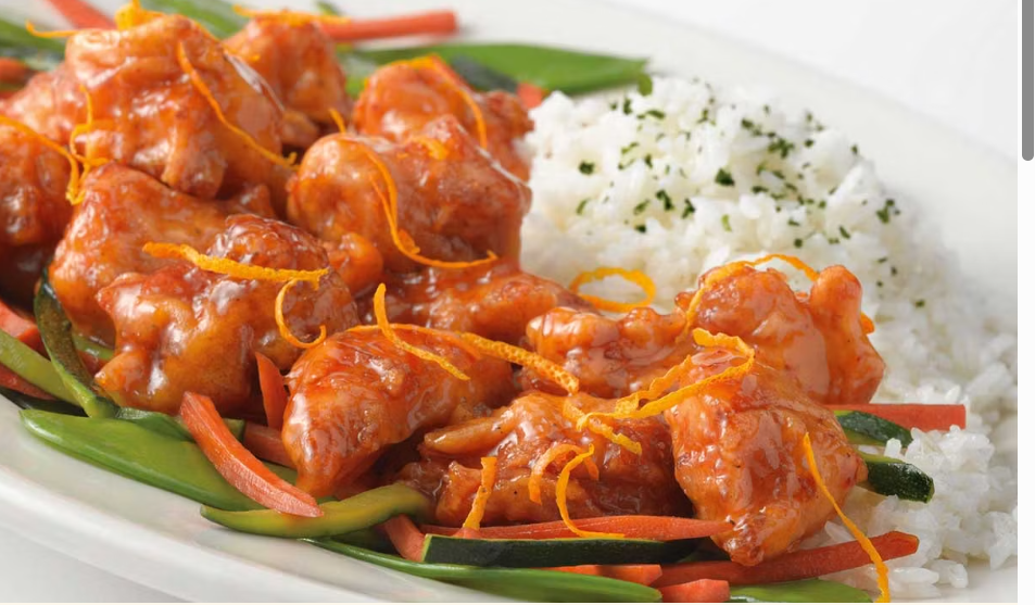 <p>Deep Fried Pieces of Chicken Breast Covered in a Sweet and Spicy Orange Sauce. Served with White Rice and Vegetables</p>