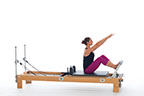 <p><strong>Setup</strong></p><ul><li><p>Starting in Stomach Massage Flat Back position (page 59), back straight, arms straight, reaching up and forward, V position, palms facing down</p></li><li><p>Resistance: medium | <strong>Springs: 2R or 2R + 1B</strong></p></li></ul><p><strong>Movement</strong></p><ul><li><p>Exhale: Straighten legs, dorsiflex feet, plantarflex feet</p></li><li><p>Inhale: Bend legs, return to start position</p></li></ul><p><strong>Muscle Focus</strong></p><ul><li><p>Spinal extensors</p></li><li><p>Spinal flexors</p></li><li><p>Knee extensors</p></li><li><p>Ankle-foot plantarflexors</p></li></ul><p><strong>Objectives</strong></p><ul><li><p>Pelvic lumbar stabilization</p></li><li><p>Knee extensor control</p></li><li><p>Ankle-foot plantarflexor strength</p></li></ul><p><strong>Cues</strong></p><ul><li><p>Keep trunk upright and stable</p></li><li><p>Keep arms on consistent diagonal line</p></li><li><p>Maintain scapular stabilization</p></li><li><p>Straighten legs completely prior to dorsiflexion and plantarflexion</p></li></ul><p></p>