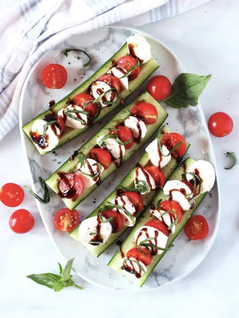 <p>Cherry Tomatoes, Fresh Mozzarella, Mini Sweet Peppers, Basil, Mediterranean Olives, Light Basil Vinaigrette, Balsamic Reduction</p>