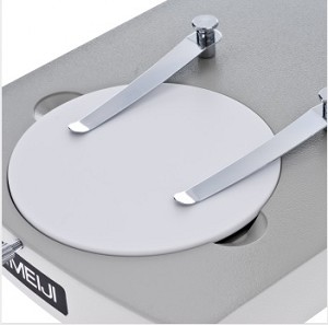 <p>The clip on the stage, and it holds the slide still.</p>