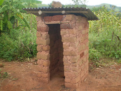 <p>A camp bathroom or toilet outside.</p>