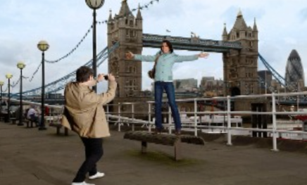<p>He takes pictures ___ his girlfriend</p>