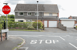 Why does this junction have a stop sign and a stop line on the road?