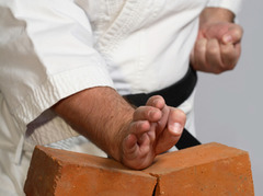 <p>Using your hands without gloves or tools.</p>