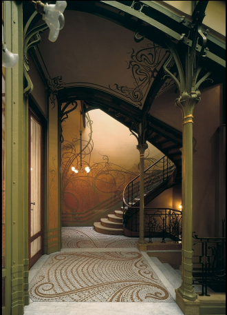 <p>The exterior of the house uses ungulating movement uniting fine arts to the buildings structure. The staircase  uses beautiful wavy/curved lines as a motif to nature and petrification along the interior</p>