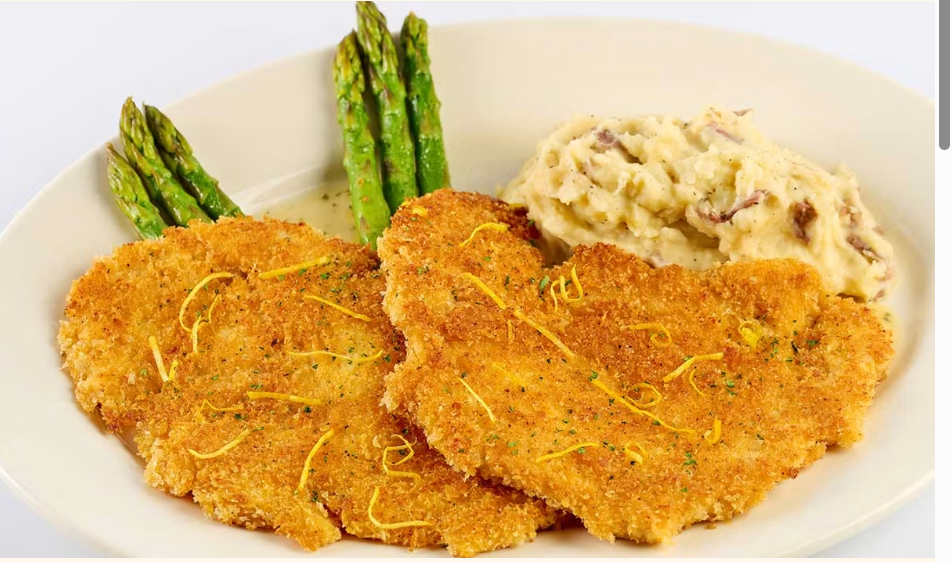 <p>Chicken Breast Lightly Breaded and Sauteed to a Crisp Golden Brown. Served with Lemon Sauce, Mashed Potatoes and Fresh Asparagus</p>