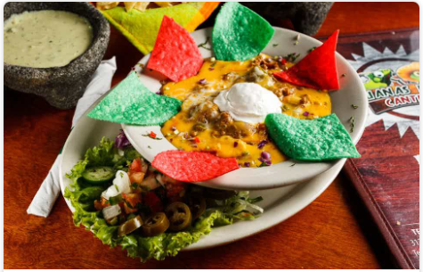 <p>Five-layer dip with refried beans, cheese, ground beef, sour cream, and chile con queso.</p>