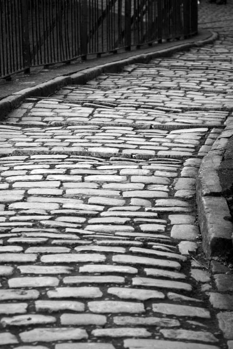 <p>made of a regular pattern of stones</p>