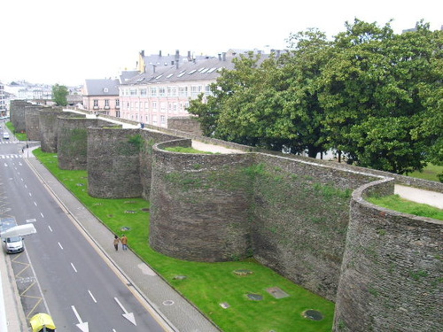 <p>strong walls built around a city to protect it.</p>
