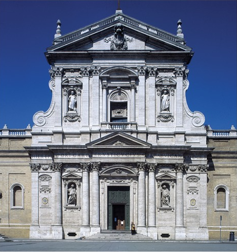 <p>The facade shown contains which of the following architectural elements?</p><p> A Flying buttresses and a central spire </p><p>B Jamb statues and a recessed portal </p><p>C Horseshoe arches and intricate muqarnas D Engaged columns and decorative pediments</p>