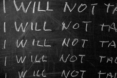 <p>repeating words or phrases to emphasize an idea or create rhythm</p>
