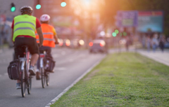 <p>Bicyclists are required to travel in which direction in relation to a vehicle?</p>