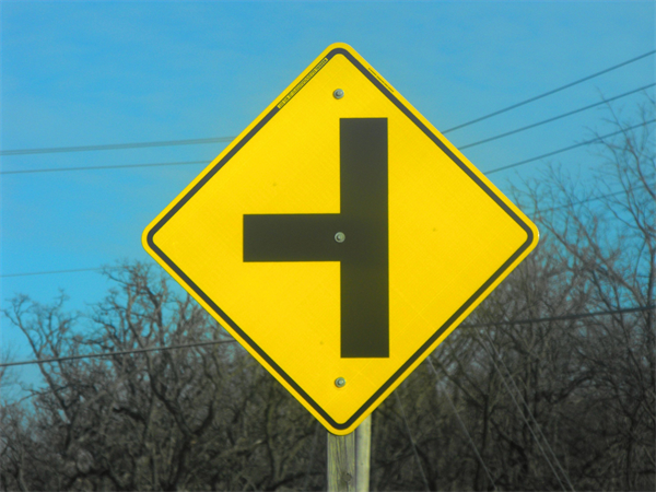 <p>Who usually has the right of way on a T intersection?</p>