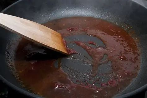 <p>Adding liquid to a pan in which meat has cooked to release its juices by simmering.</p><p>Used to release food from the pan to help flavor sauces.</p>