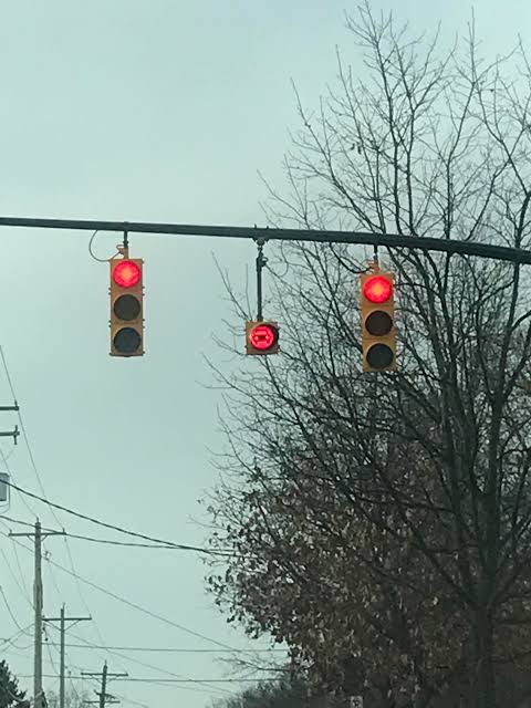 <p>Stop completely, then proceed when safe. </p>