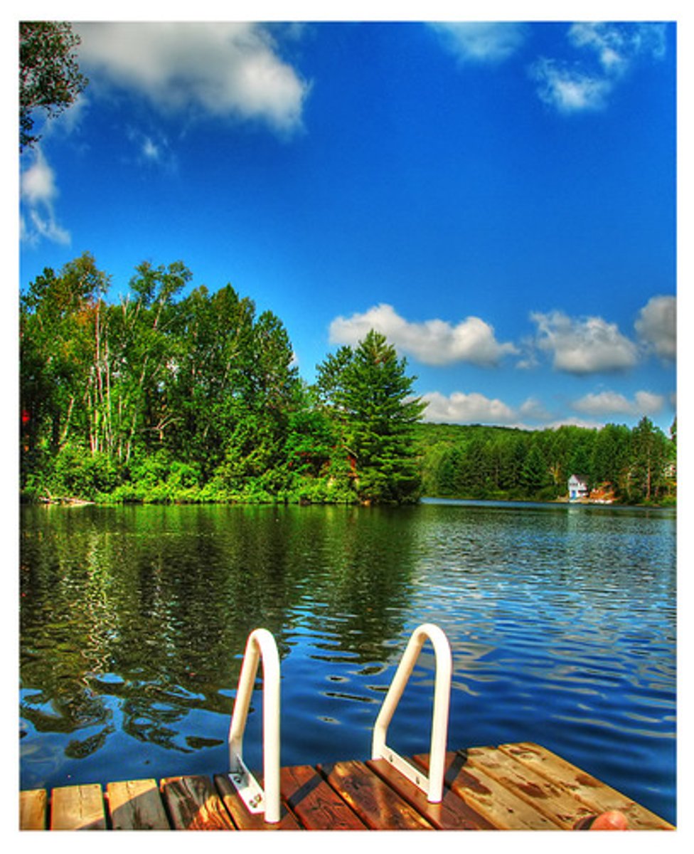 <p>a large area of water surrounded by land.</p>