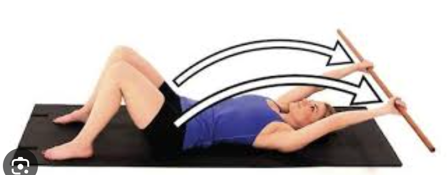 <p>can be performed in supine or standing. Both hands are on</p><p>the dowel, with the pt lifting the arms overhead</p>