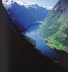 <p>(n.) a high point of land extending into water</p><p>Latin: "mons" meaning "mountain"</p>